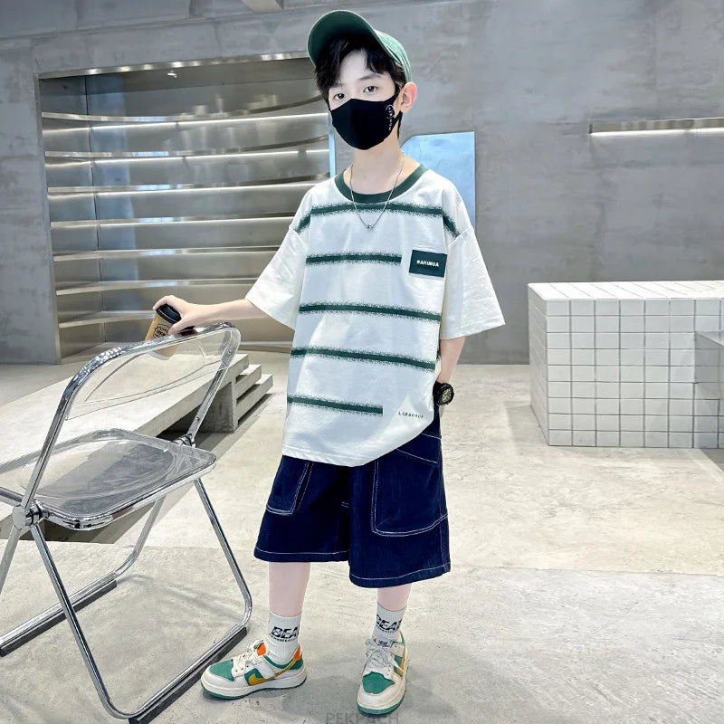 Person wearing a striped shirt and cap indoors