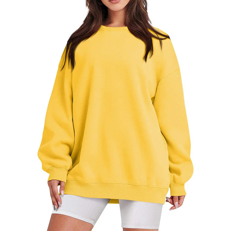 Yellow sweatshirt worn by a person on a white background