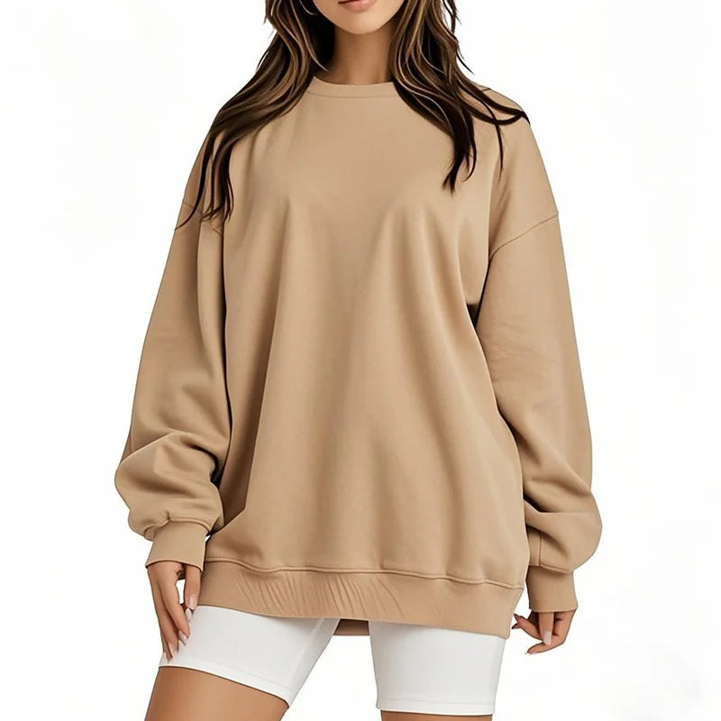 Beige sweatshirt worn by a person on a white background