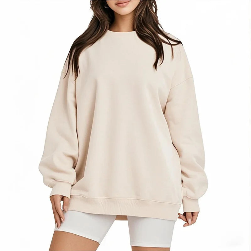 Beige sweatshirt worn by a person on a white background