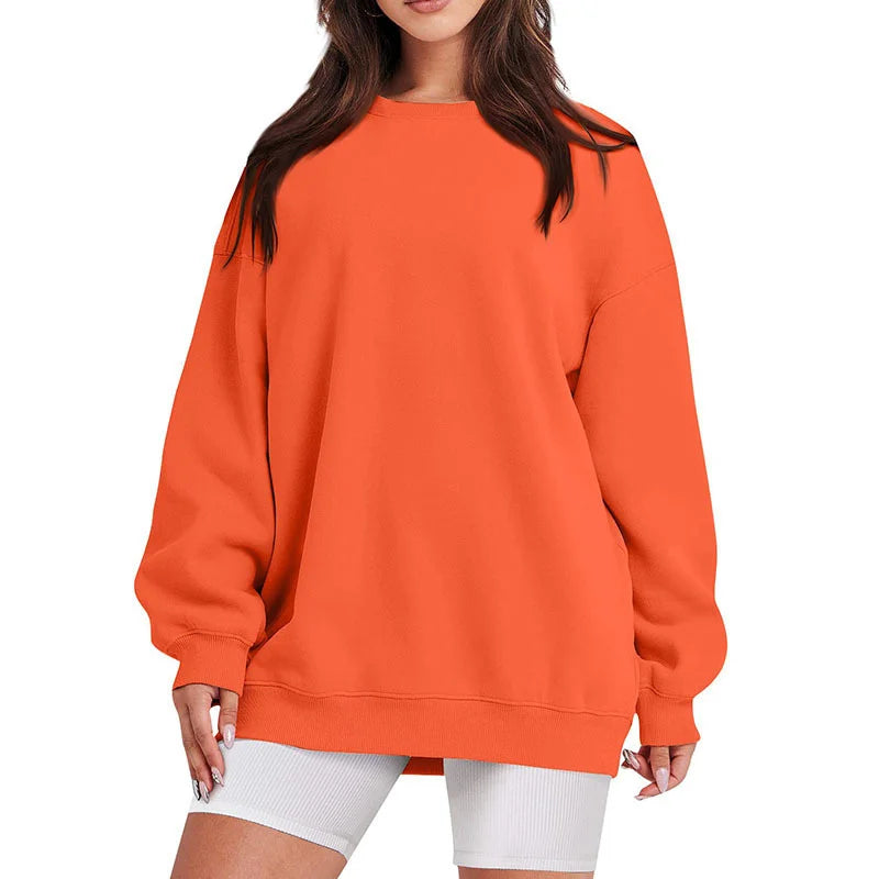 Orange sweatshirt worn by a person on a white background