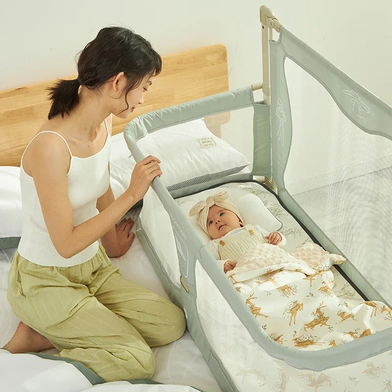 Woman with a baby in a crib with a safety gate, in a bedroom setting.