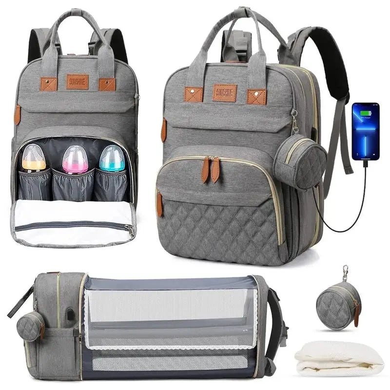 Multifunctional gray diaper bag with various compartments and accessories on a white background