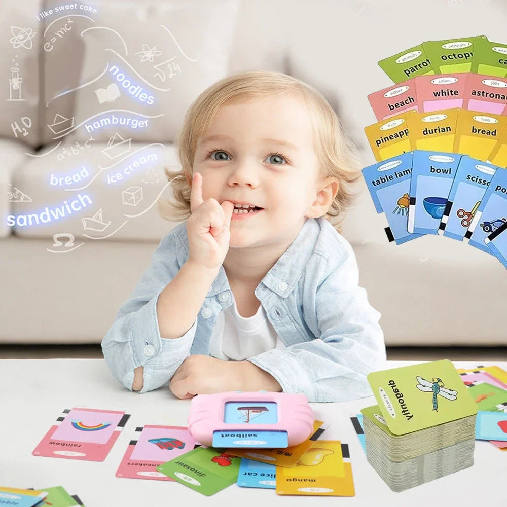 Child playing with educational flashcards and a toy on a light-colored surface.