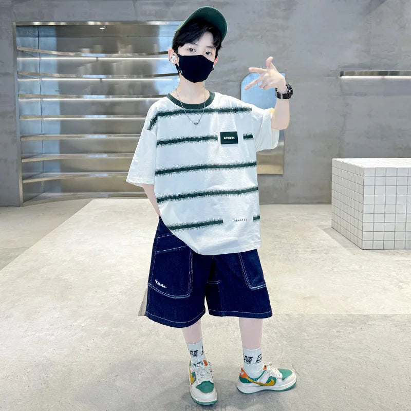 Person wearing a striped shirt and dark shorts in an indoor setting