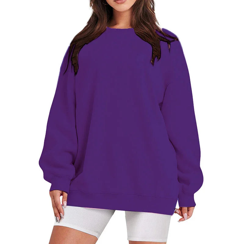 Purple sweatshirt worn by a person on a white background