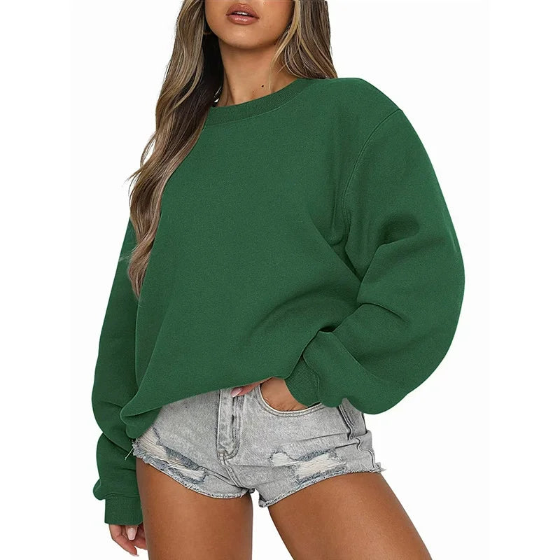 Green sweatshirt worn by a person on a white background