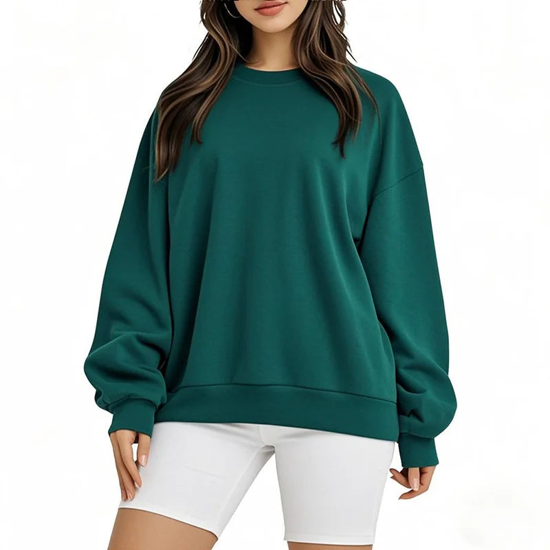 Person wearing a teal sweatshirt and white shorts on a white background