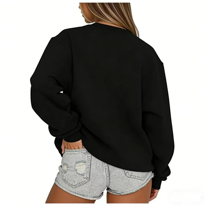 Person wearing a black sweatshirt and denim shorts on a white background