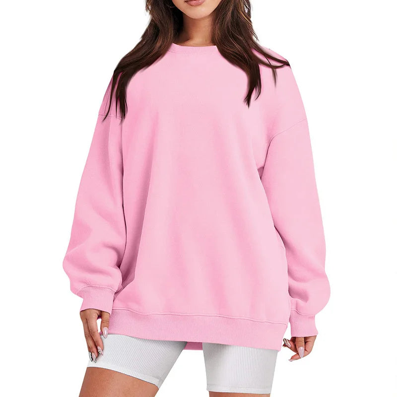 Pink sweatshirt worn by a person on a white background