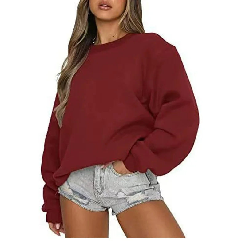 Red sweatshirt worn by a person on a white background